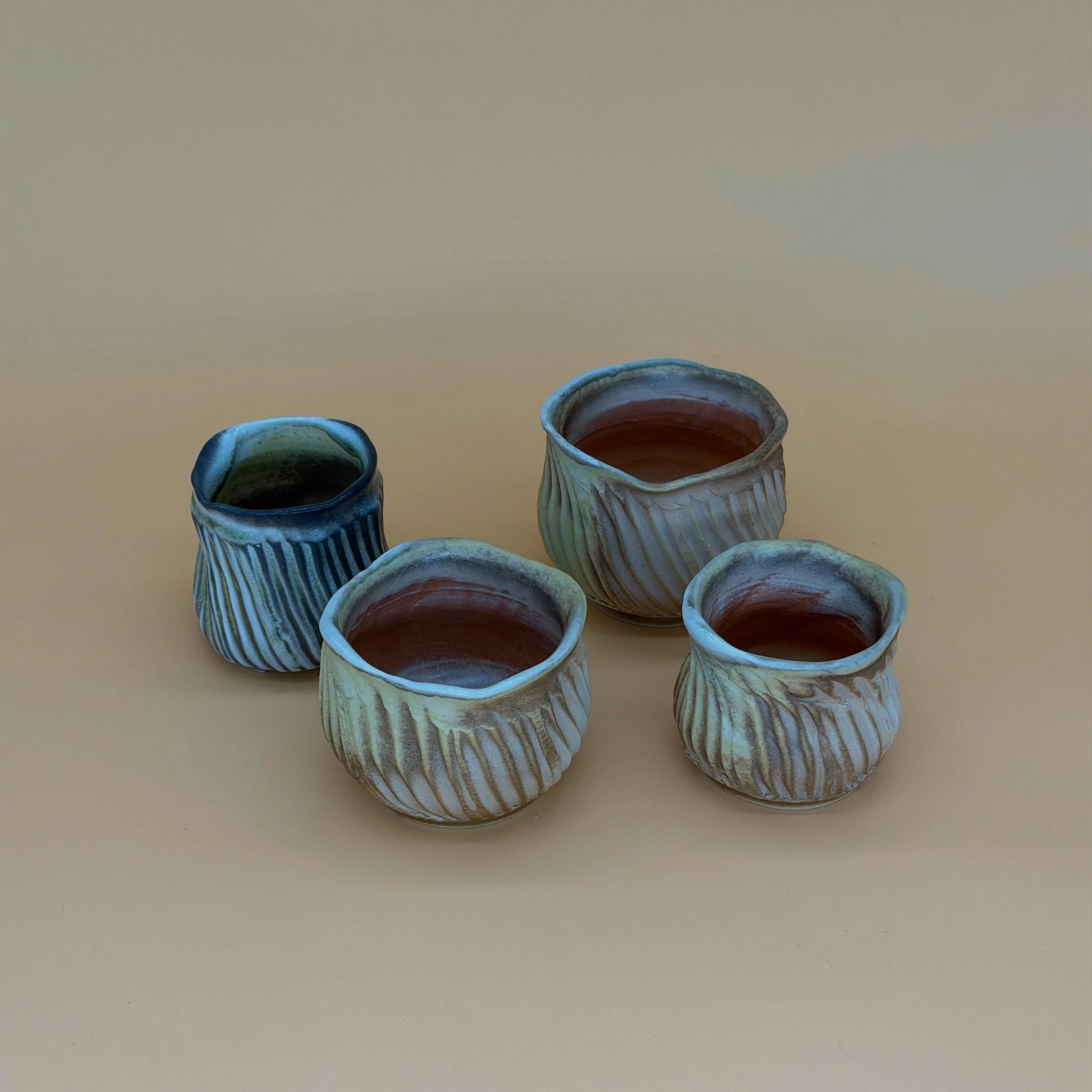 porcelain "pants" cups

more facets on wheel thrown cups, this time with a wiggle wire and then bellied out after faceting. "pants" bc they remind me of when your pants are a lil too long and the fabric collects at the heel of you