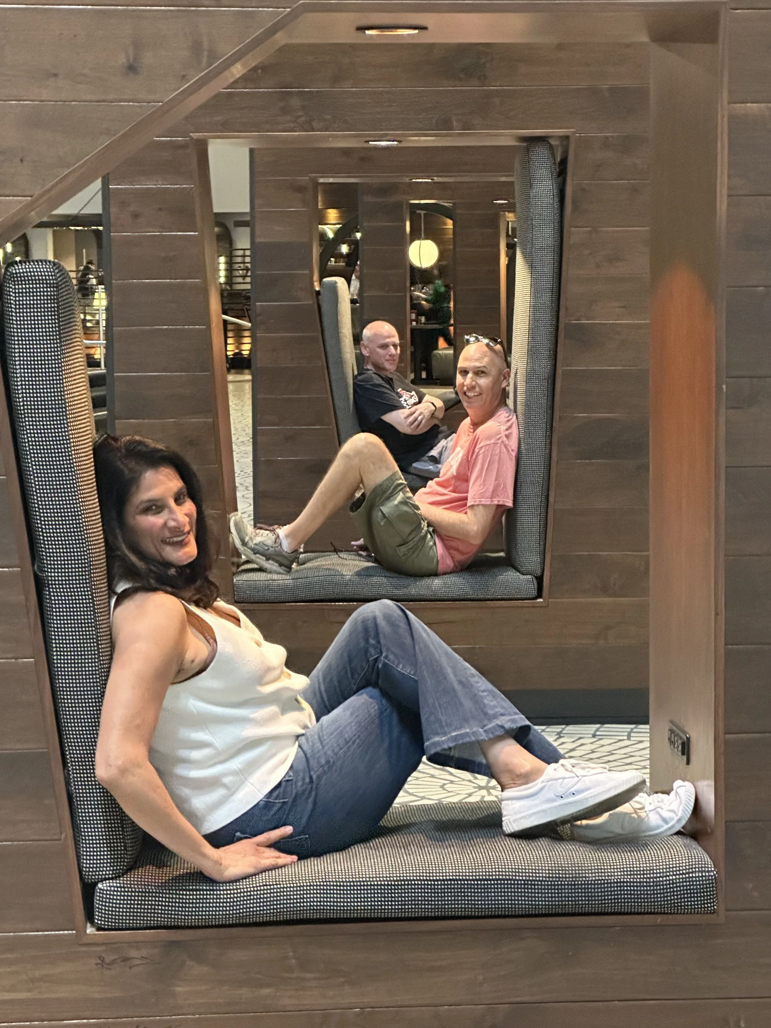 Three people taking a group photo in a hotel or restaurant in San Francisco.