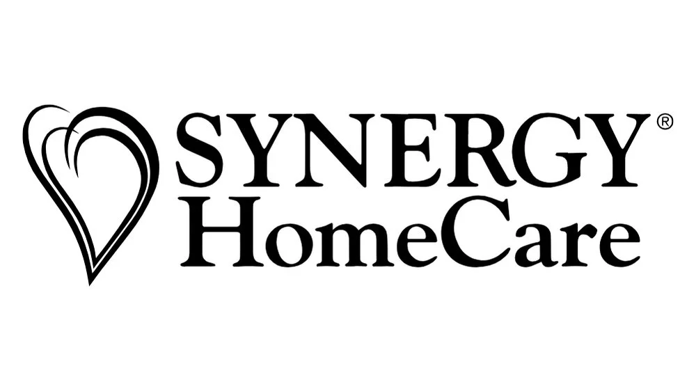 Logo for Synergy HomeCare, featuring a stylized heart with three lines and the text 'Synergy HomeCare' in black.