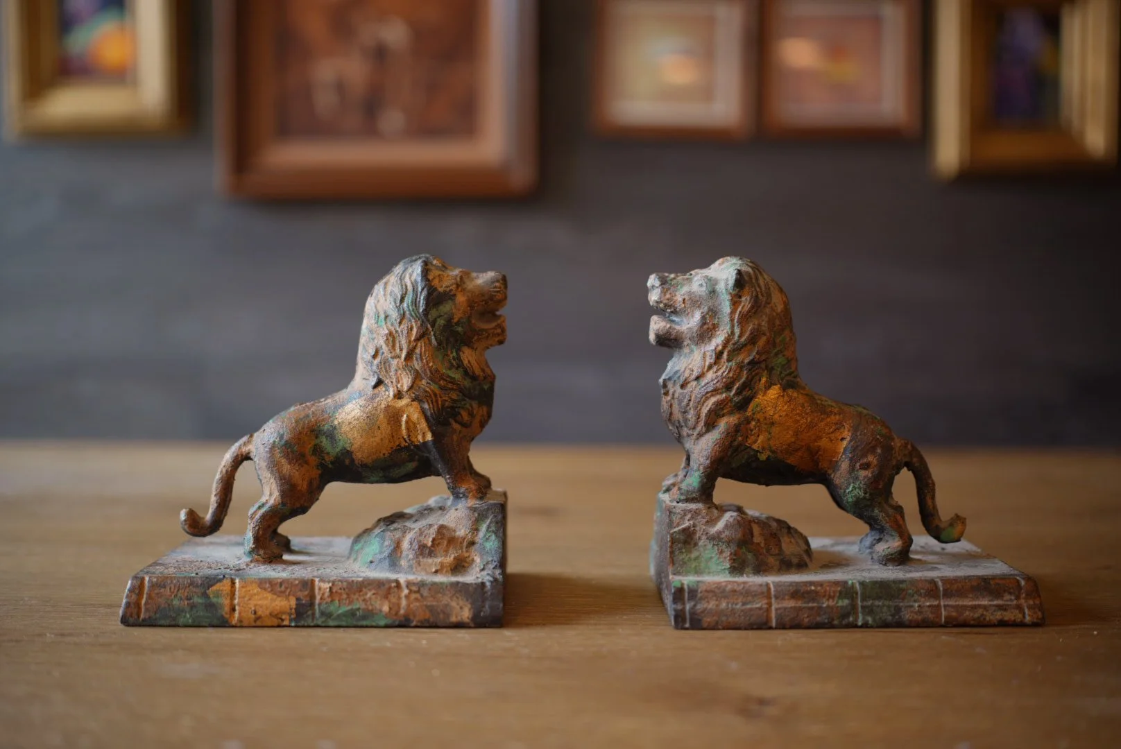 Pair of Gilt and Verdigris Cast Iron Lion Bookends