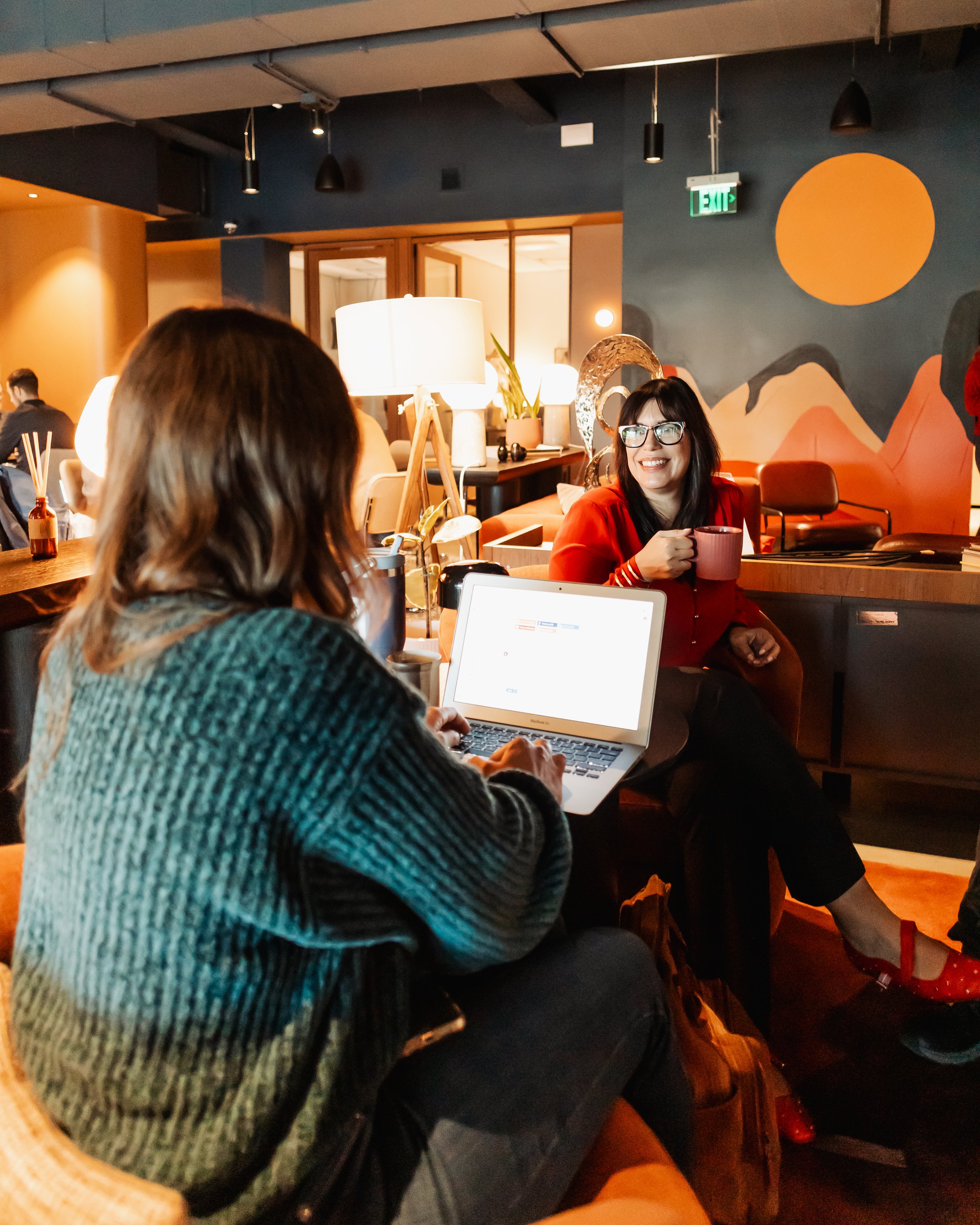 Coworkers working together at 9+Co in Denver at TARRA