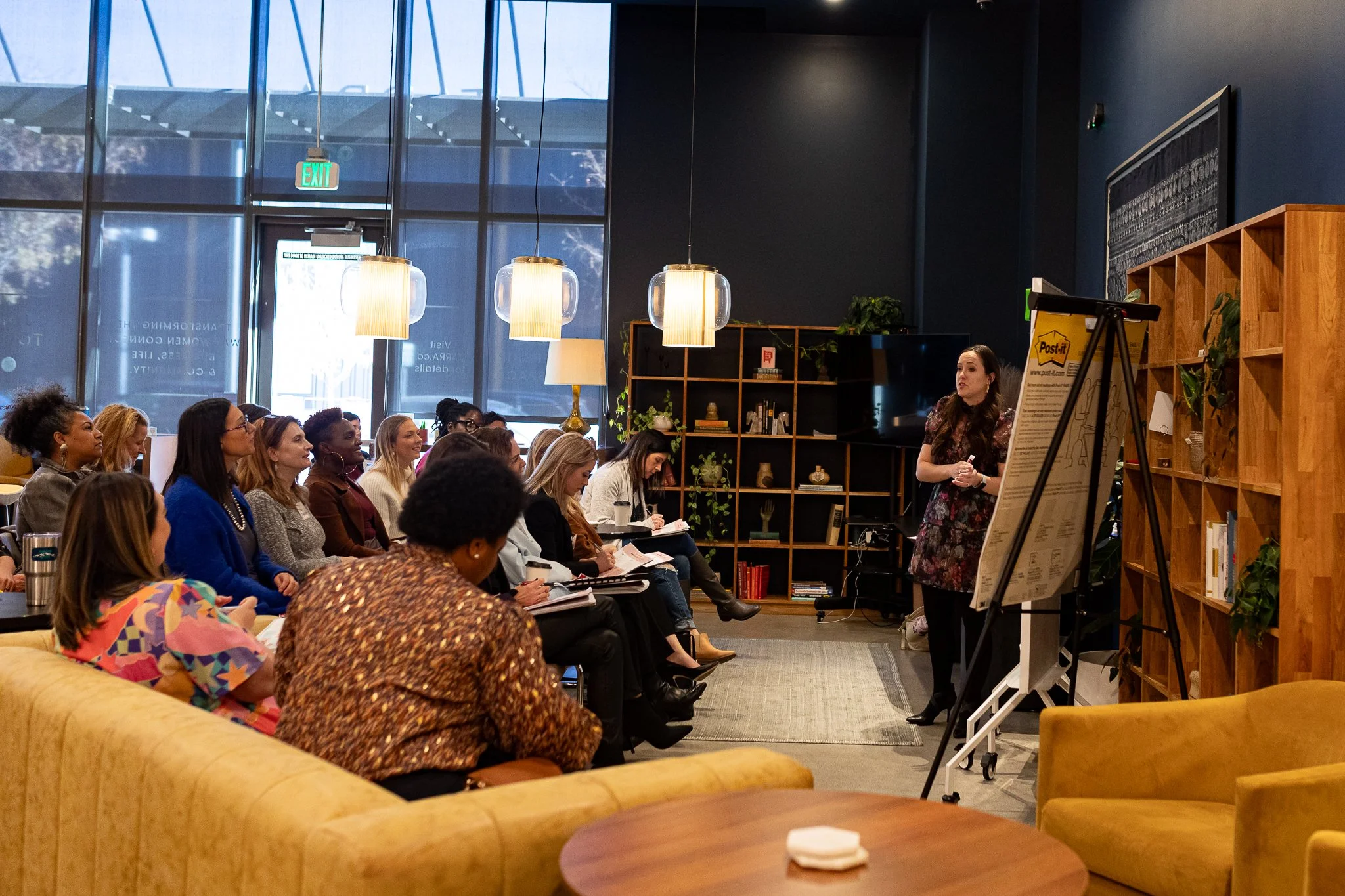 Corporate workshop hosted in TARRA event space in Denver with presentation screen and seating