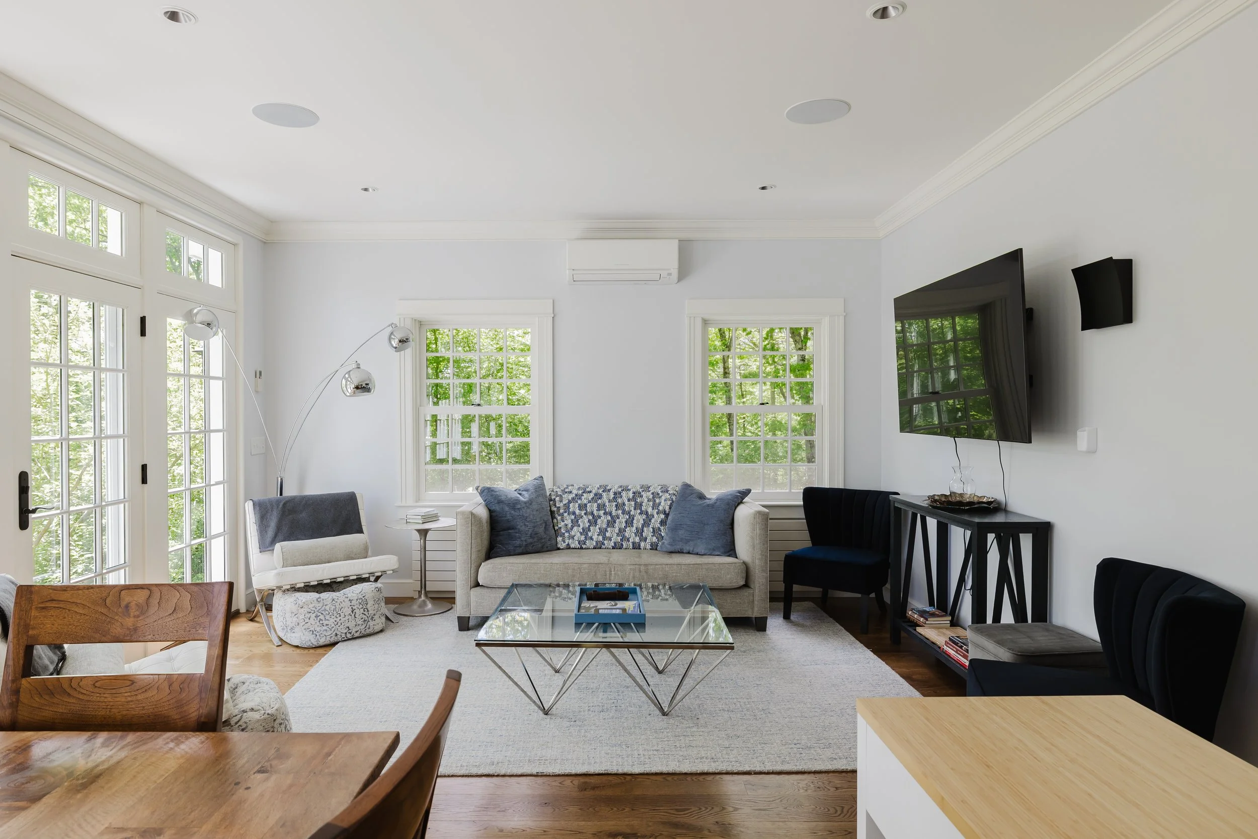 Living area with Smart TV and forest views