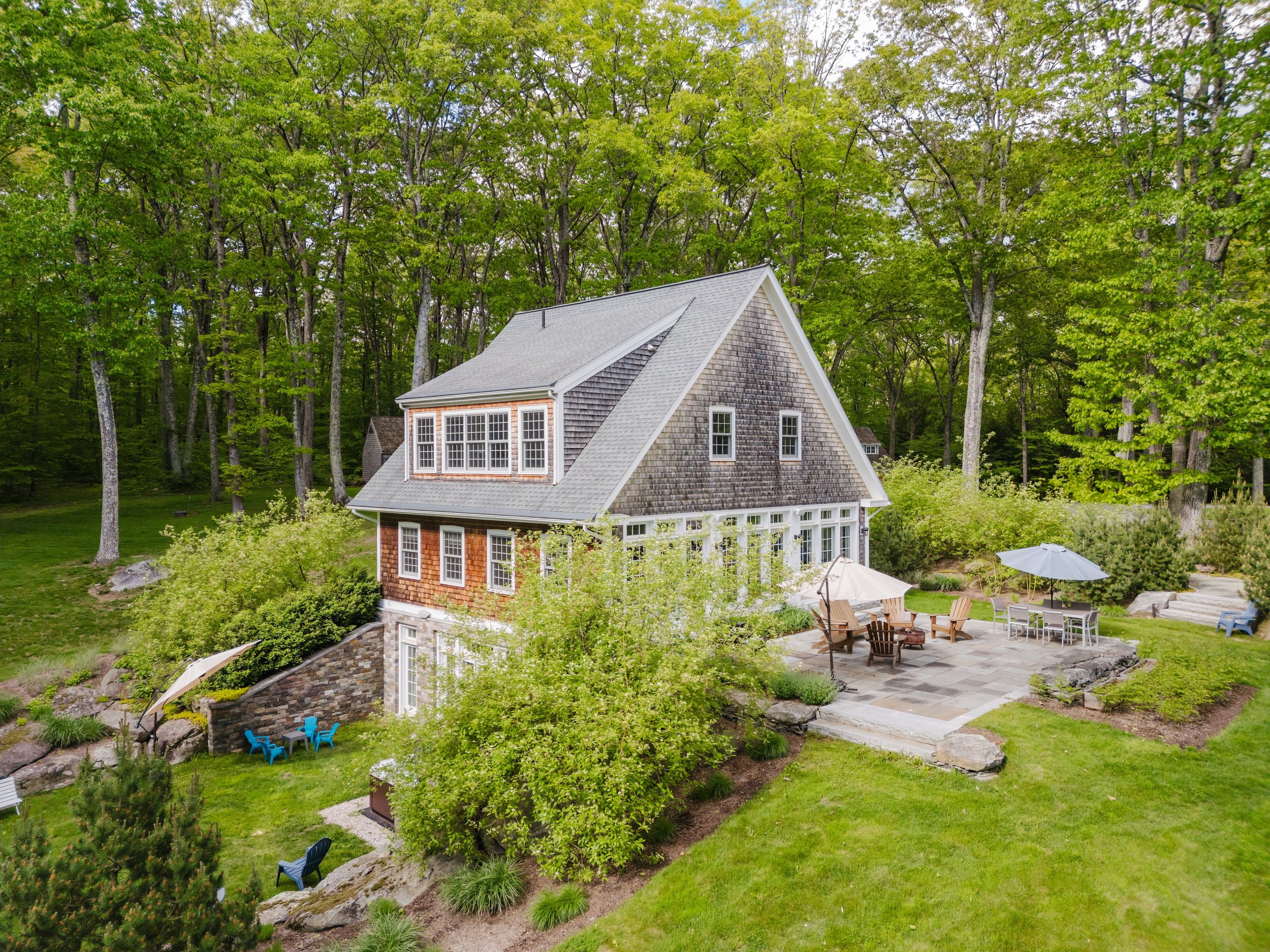 Exterior side of guest house with patio seating