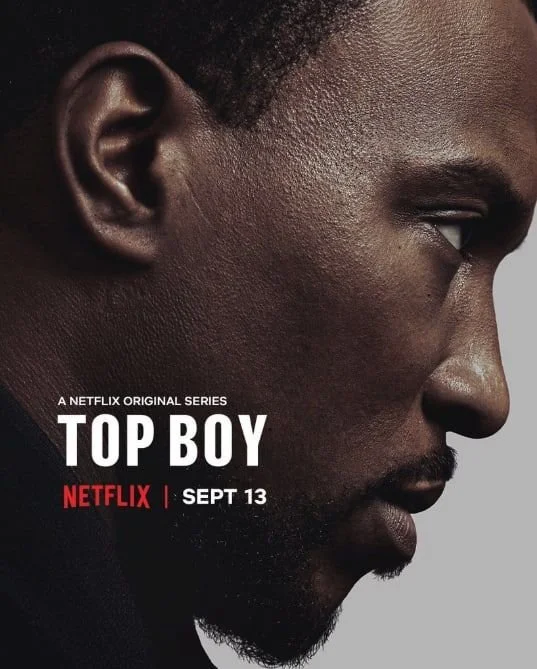 Close-up profile of a young Black man with a serious expression, advertising the Netflix series "Top Boy," premiering on September 13.