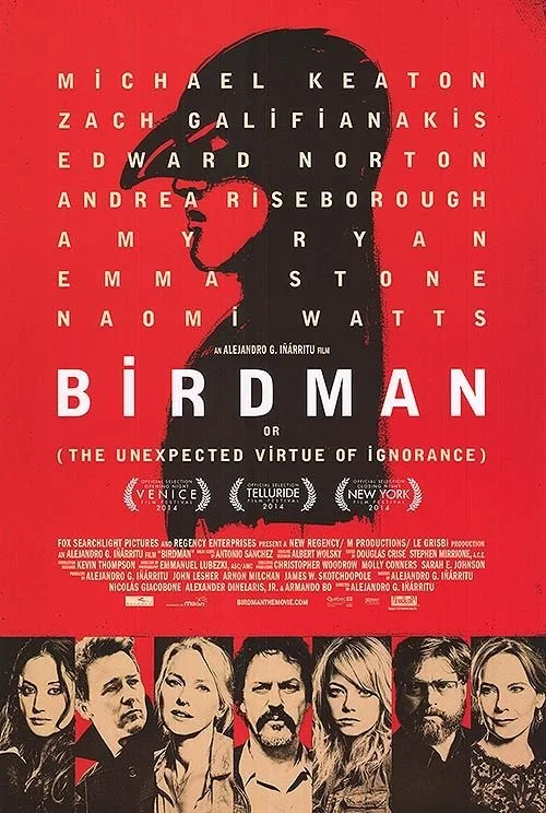 Red movie poster for "Birdman" featuring a silhouette of a man's face in profile with a bird silhouette on his head, and photos of seven characters at the bottom.