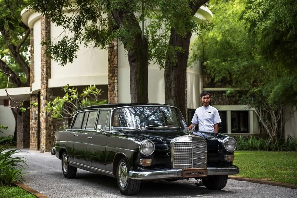 "A private transfer waiting at a luxury hotel entrance.