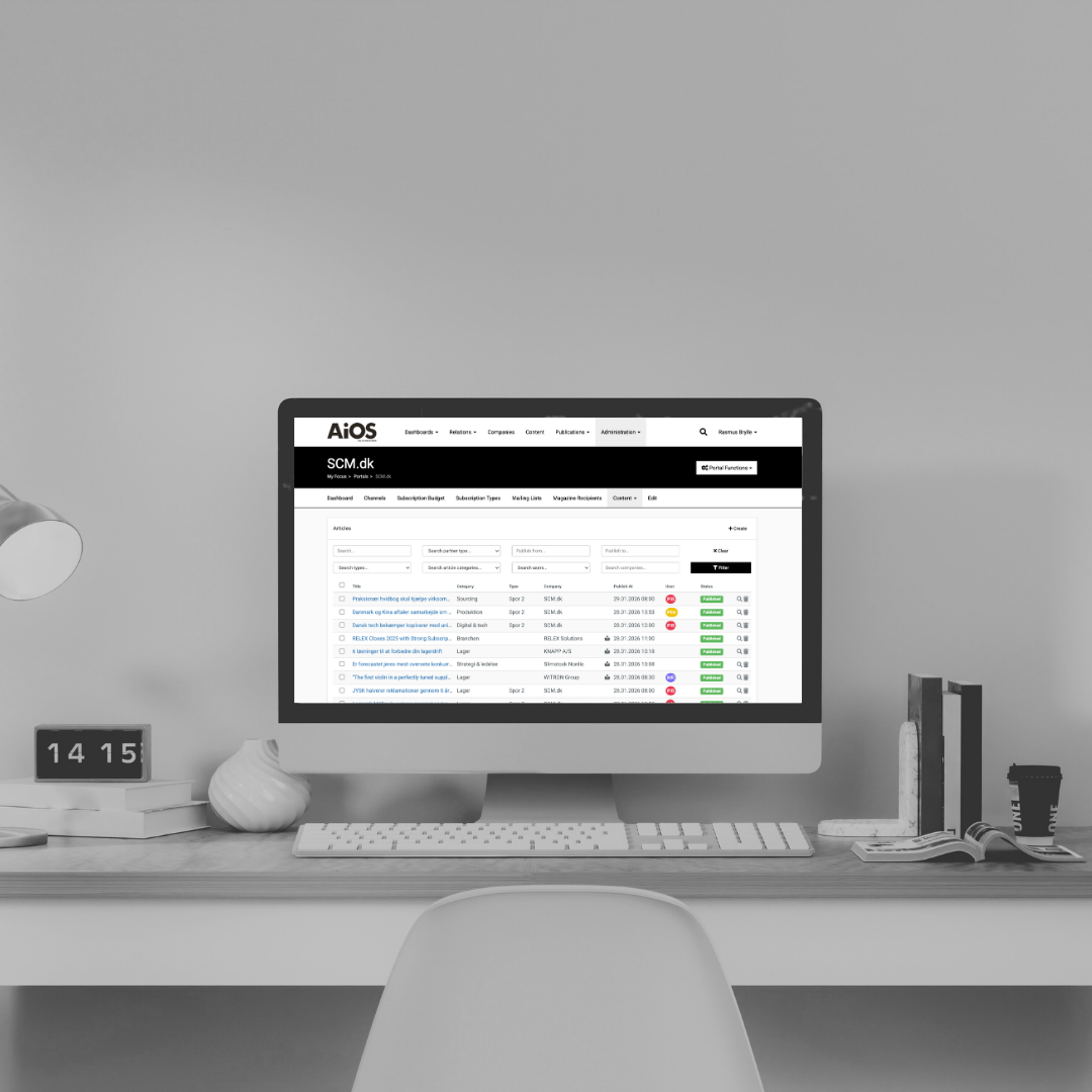 Desktop computer on a neatly organized desk with a search interface on the monitor, a small digital clock, a potted plant, and various office supplies in a minimalist room.