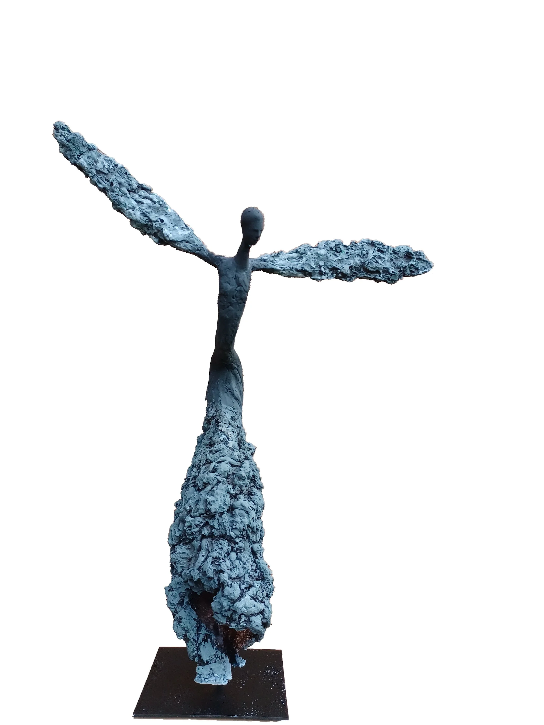 Sculpture of an abstract figure with outstretched wings, standing on a base, made of textured, rough materials, with a slender body and a featureless face, set against a plain white background.