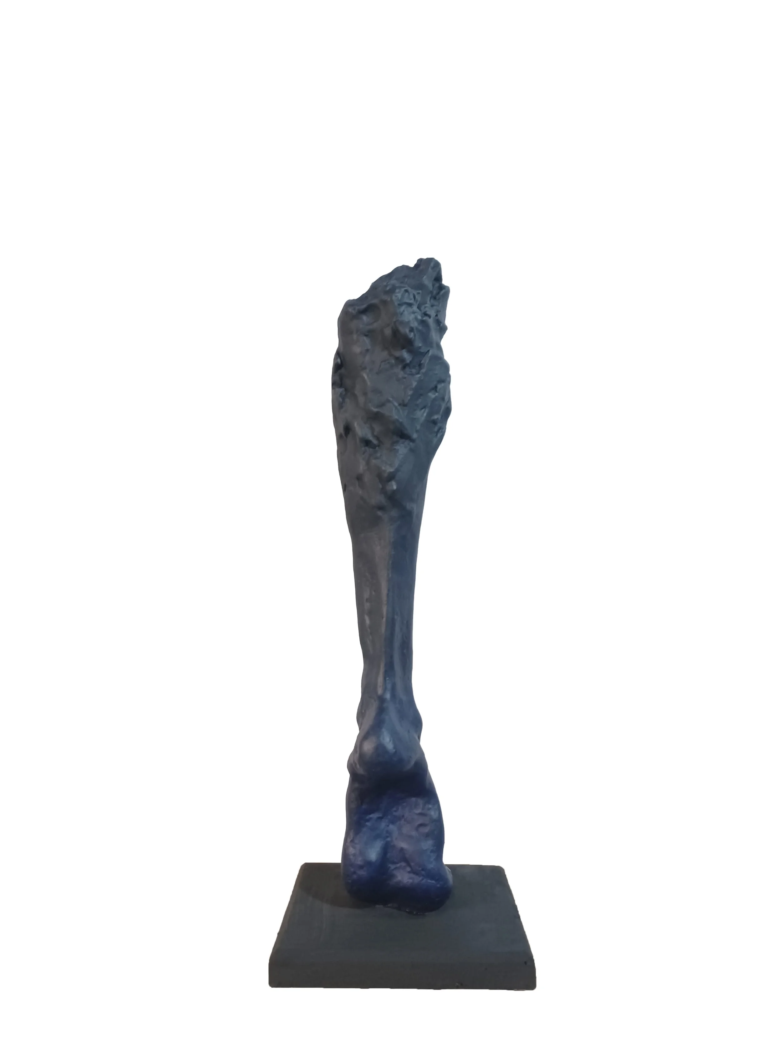 A blue abstract sculpture on a black rectangular base.