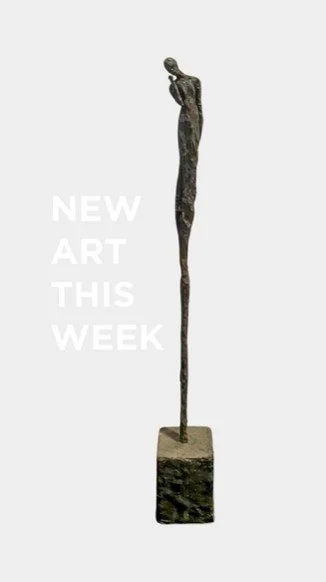 Sculpture of a tall, slender figure with a small head, standing on a rectangular base, with text "New Art This Week" beside it.