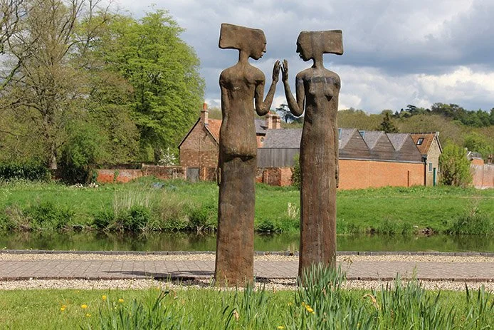 A figurative sculpture exploring simplified form and emotional presence, inspired by the storytelling traditions of the Nigerian Delta.