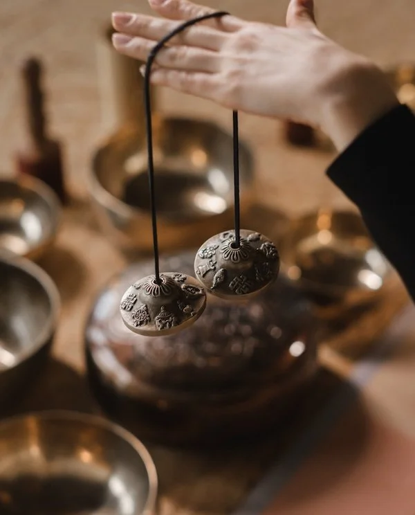 Tommi holding healing chimes