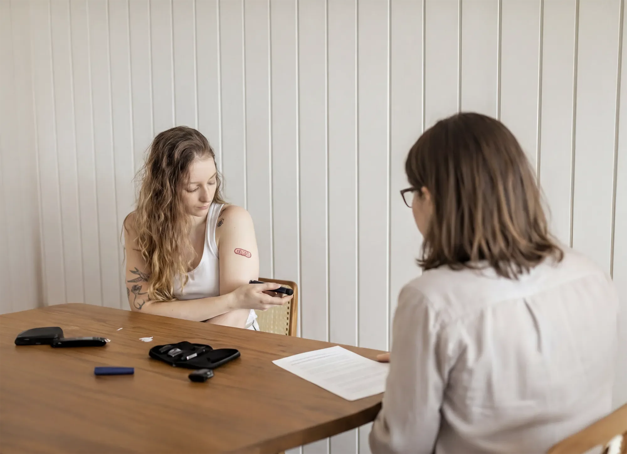 Researcher interviewing participant during healthcare usability study.