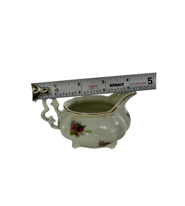 Alt text: ESCO Japan porcelain creamer with a tape measure showing approximately 4 inches from handle to spout