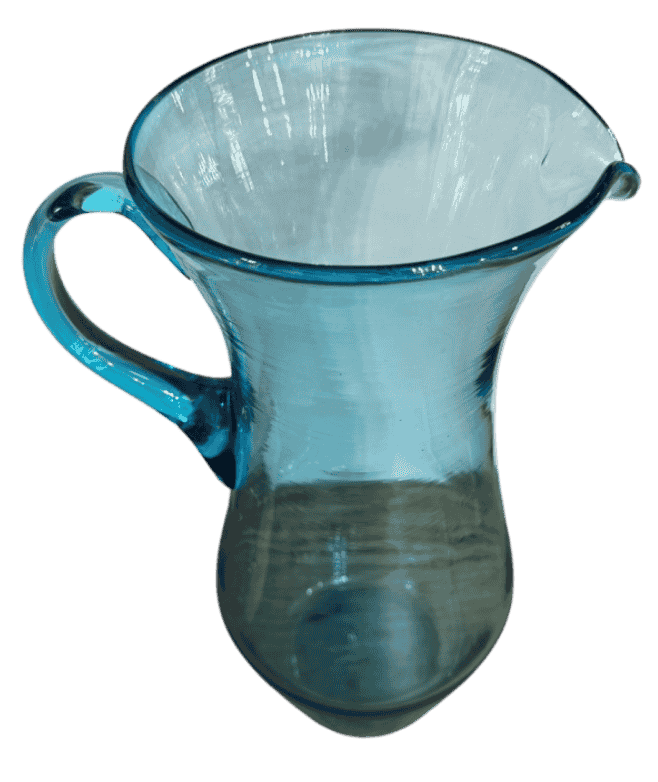 Top view of an antique aqua Top view of an antique hand-blown aqua glass pitcher showing its flared rim, pouring spout, and transparent aqua interior