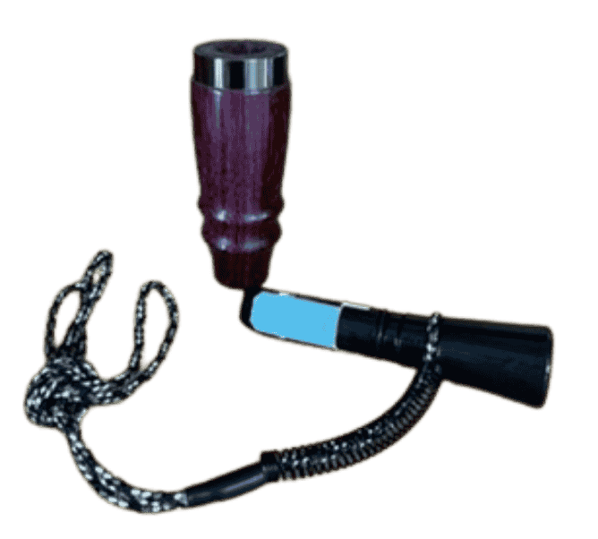 Disassembled Purpleheart single reed duck call showing hardwood barrel and gunmetal mouthpiece handcrafted in Louisiana.
