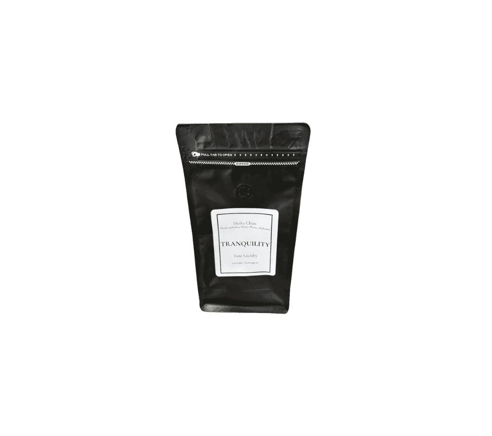 Heifer Clean Tranquility luxe powder laundry detergent with lavender lemongrass fragrance.