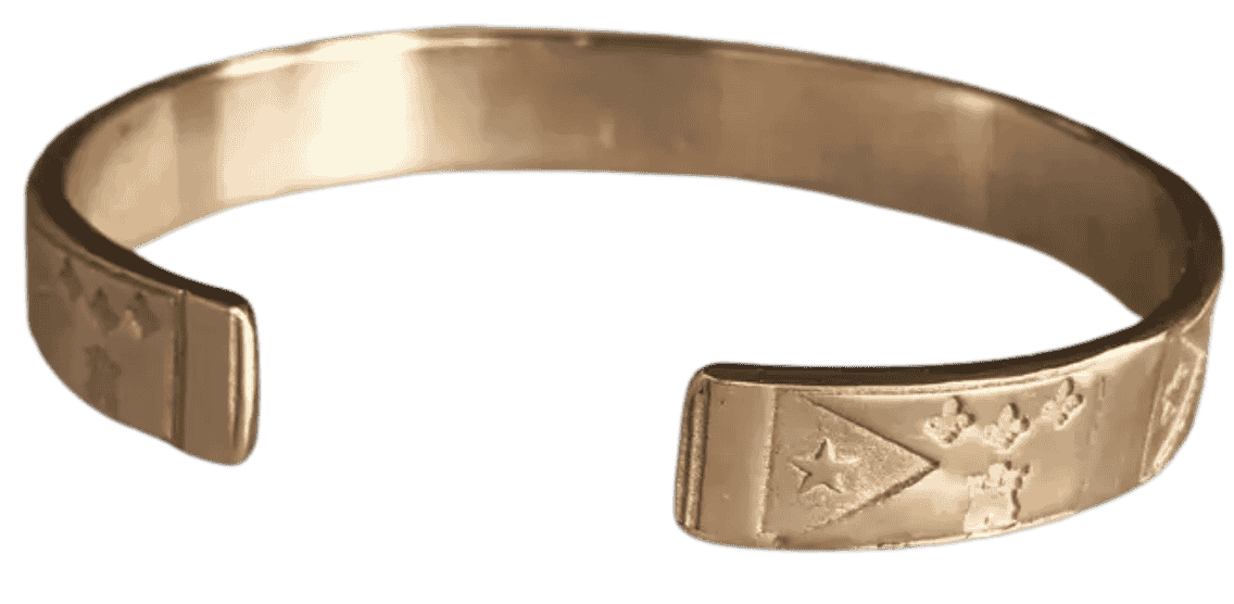 Solid cast metal Acadiana flag cuff bracelet with repeating Acadian star, fleur-de-lis, and castle design.