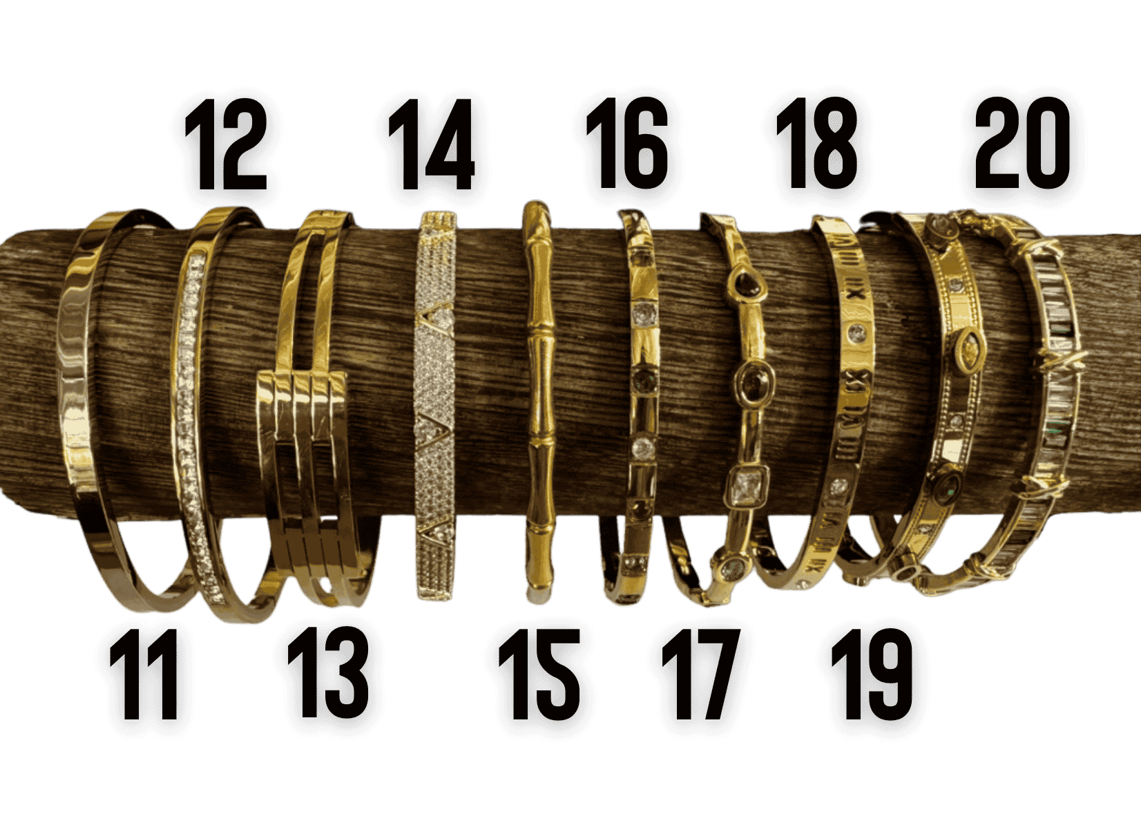 Gold tone bangle bracelet collection with crystal, Roman numeral, bamboo, and Greek key designs.