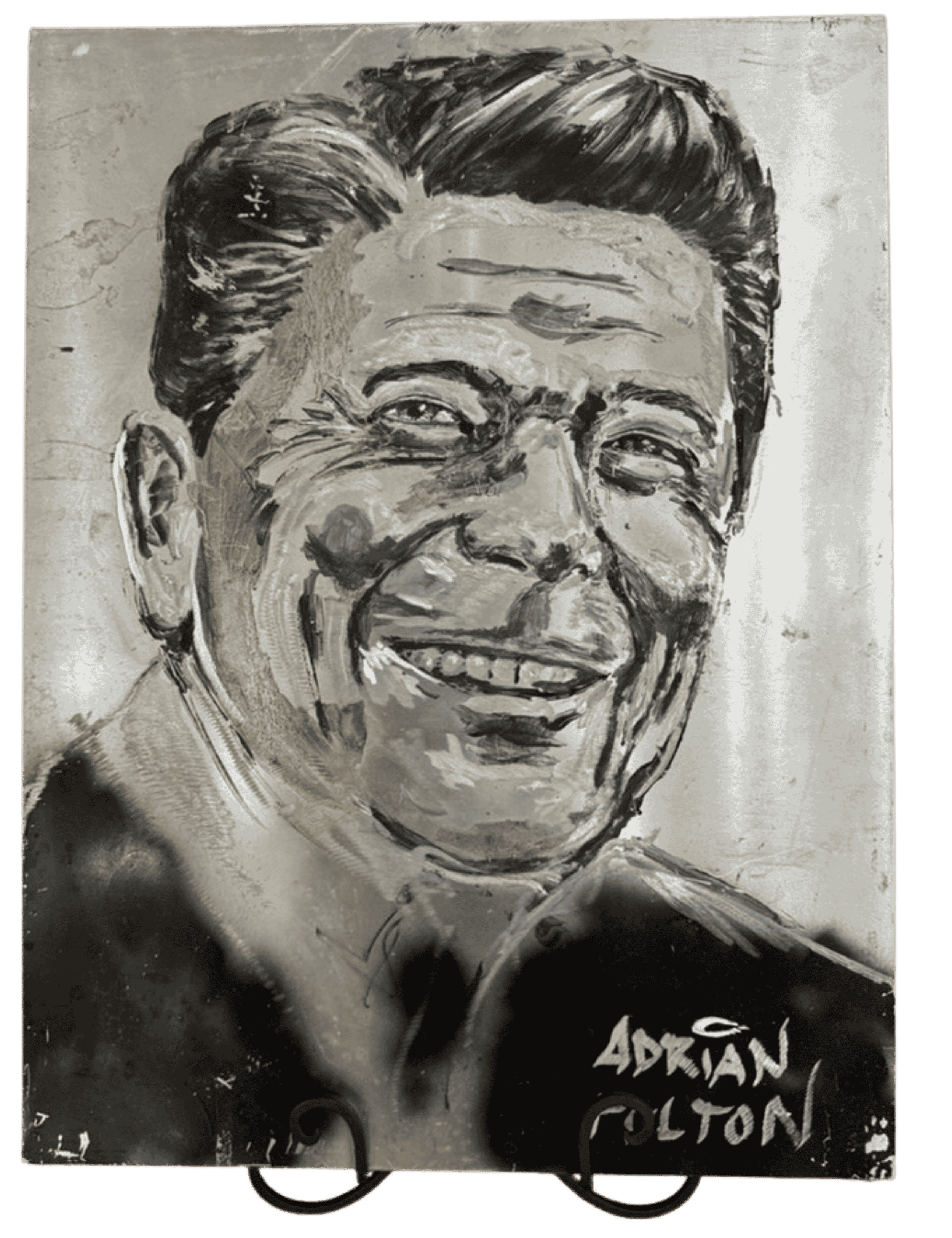 Close-up of Ronald Reagan portrait engraving on aluminum showing detailed hand-engraved facial features.