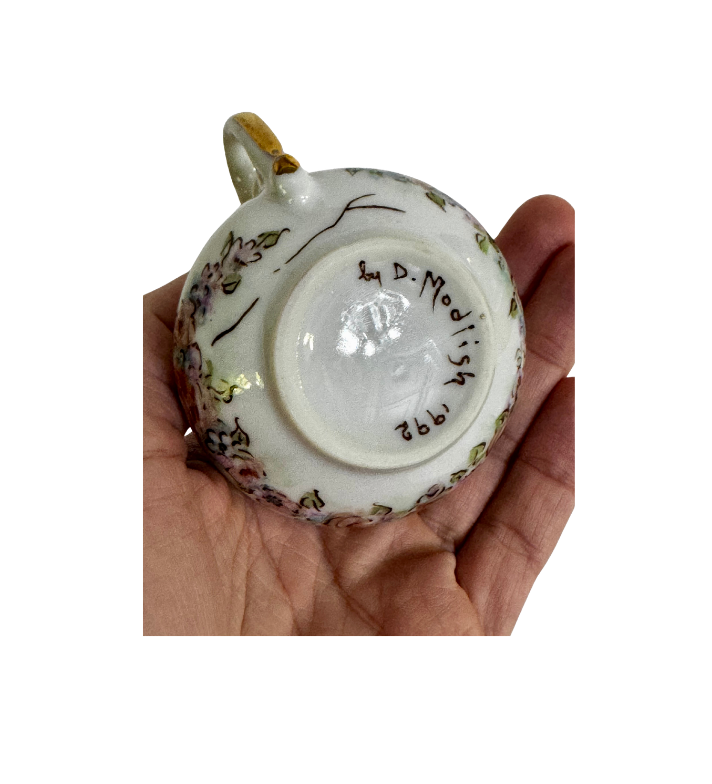 Underside of the ceramic gumbo filé server showing the handwritten D. Modish signature and 1992 date