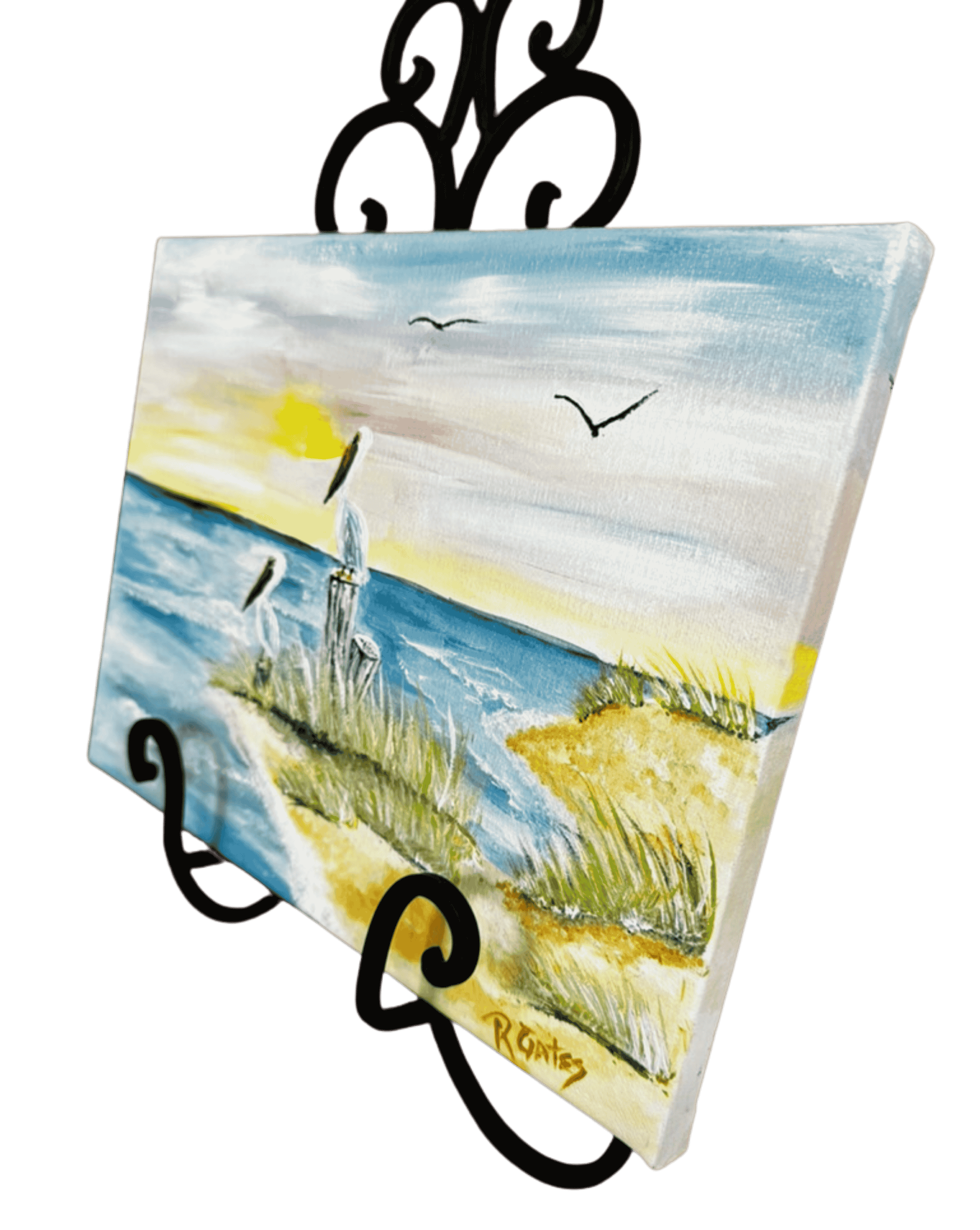 Side view of original pelican painting featuring a Gulf Coast shoreline, marsh grasses, blue water, and two resting pelicans.