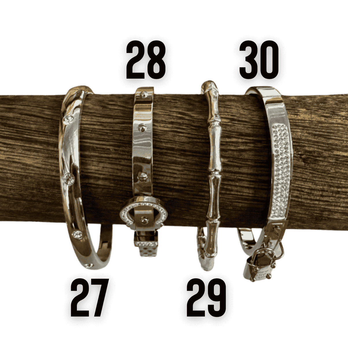 Gold tone bangle bracelet collection with crystal, Roman numeral, bamboo, and Greek key designs.