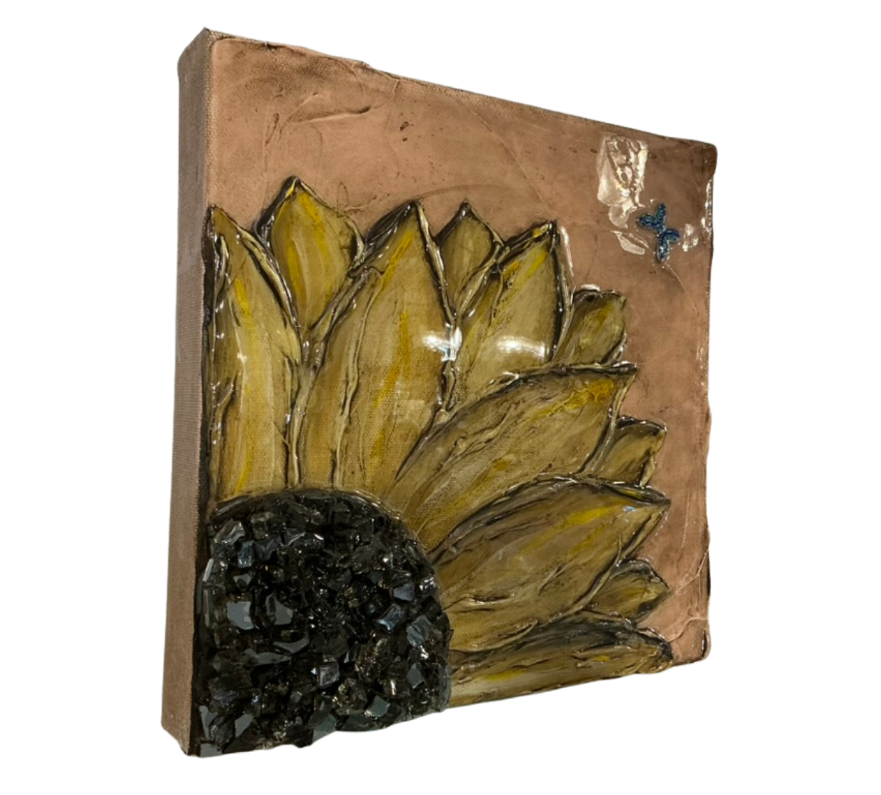 Angled left-side view of textured sunflower canvas highlighting dimensional petals, raised mixed media details, glossy surface, and black gemstone-style center.
