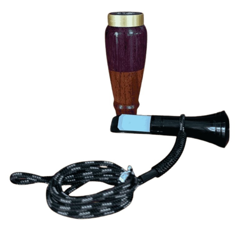 Disassembled Purpleheart and Ebiara duck call showing two-tone hardwood barrel and black mouthpiece handcrafted in Louisiana.