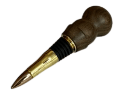 Close-up of ziricote wood bottle stopper showing dramatic spider-web grain pattern and polished brass bullet casing tip.