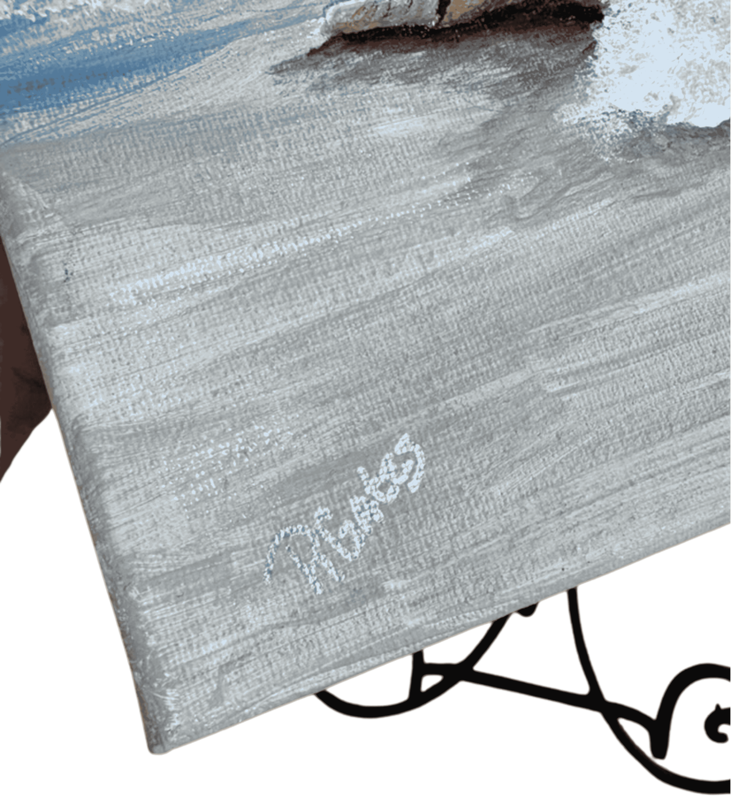 Close-up of the artist signature “R. Gates” painted in white on the lower corner of an original acrylic coastal painting.