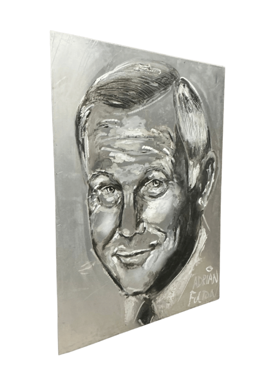 Angled view of Adrian Fulton’s hand-engraved Johnny Carson portrait showing metallic texture and dimensional engraving on aluminum.