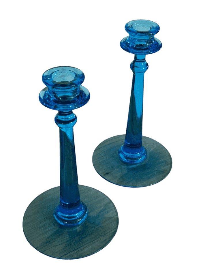 Top view of pair of vintage aqua blue Fenton candlesticks showing candle cups and glass bobeche design.
