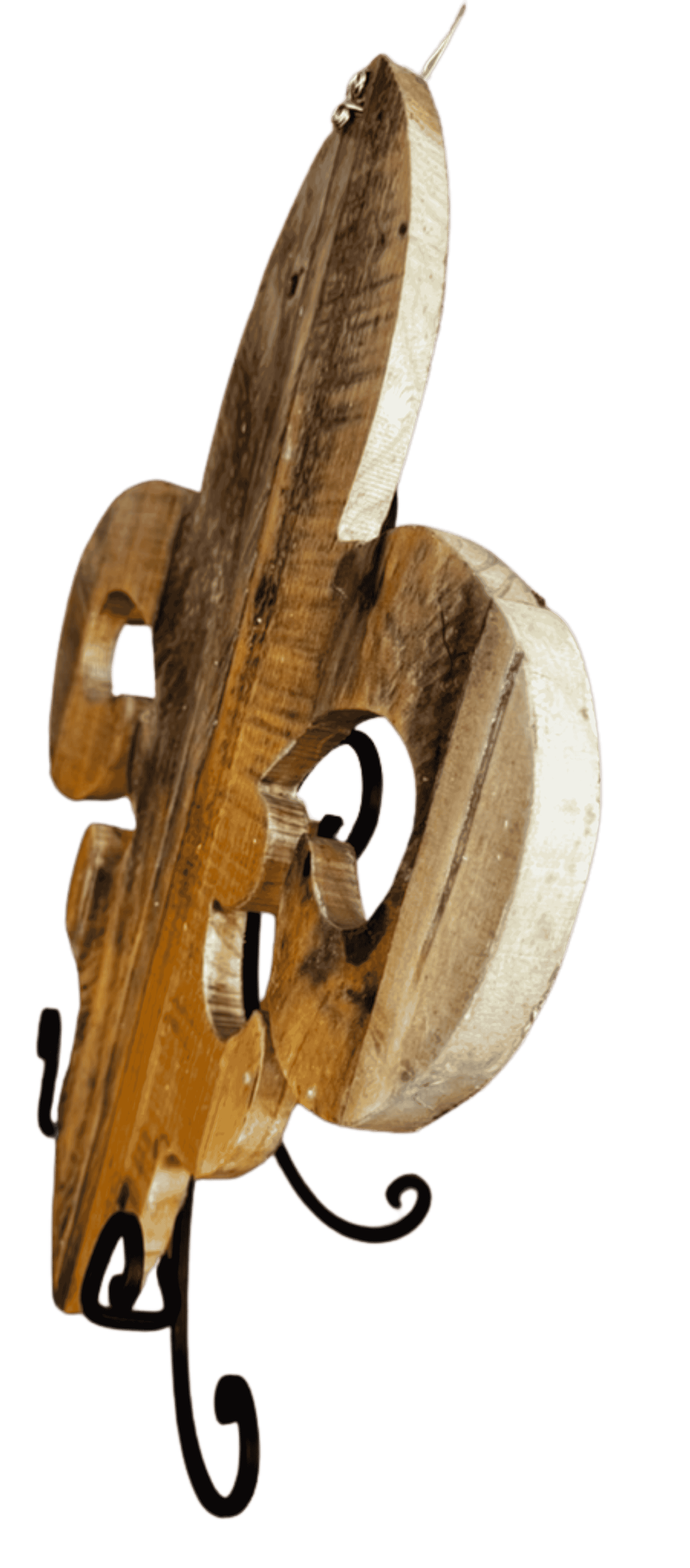 Side view of rustic reclaimed wood fleur-de-lis wall decor showing thick carved wood profile.