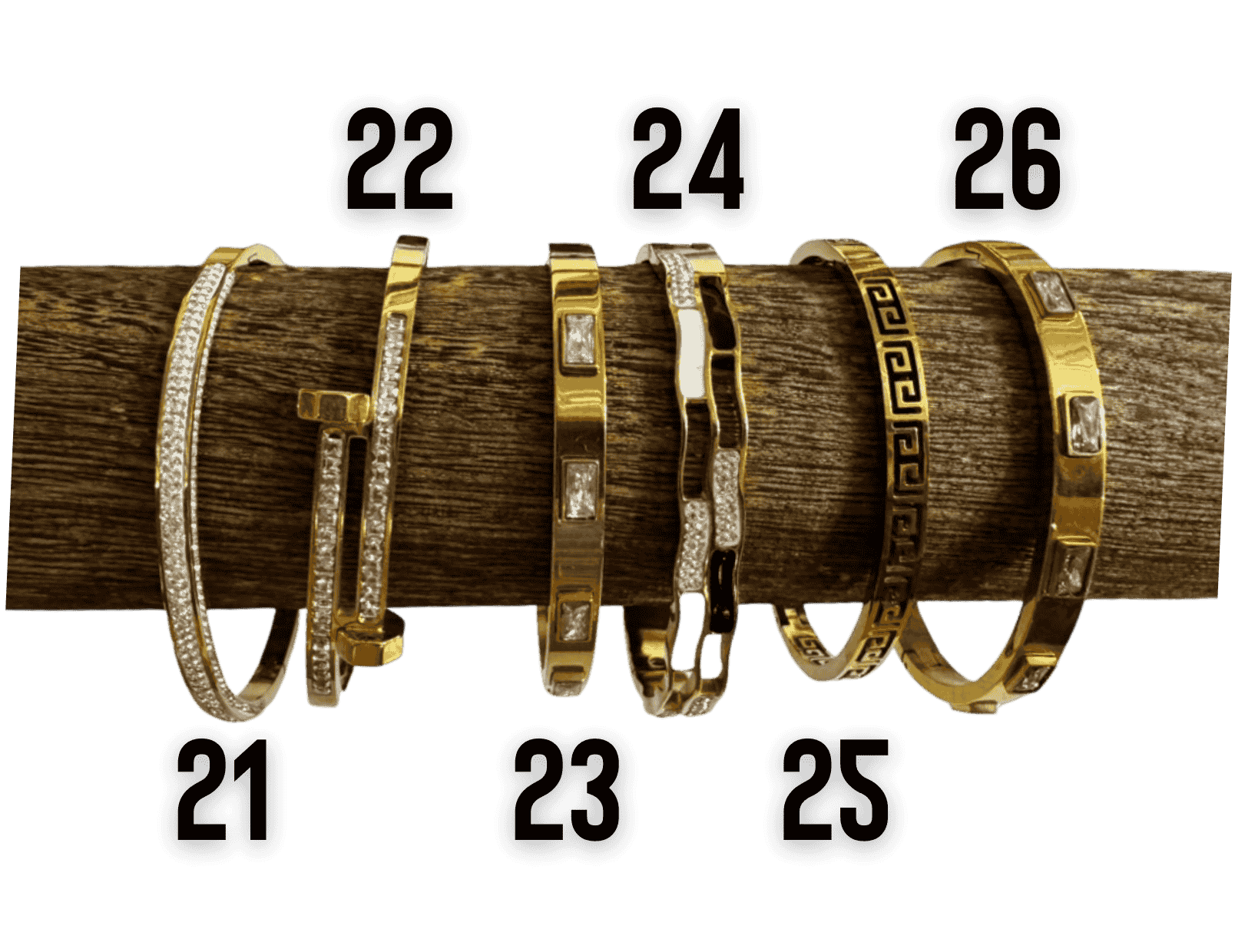 Gold tone bangle bracelet collection with crystal, Roman numeral, bamboo, and Greek key designs.