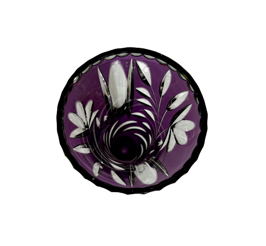 Top view inside a Bohemian amethyst crystal vase showing botanical cuts and the deep purple interior