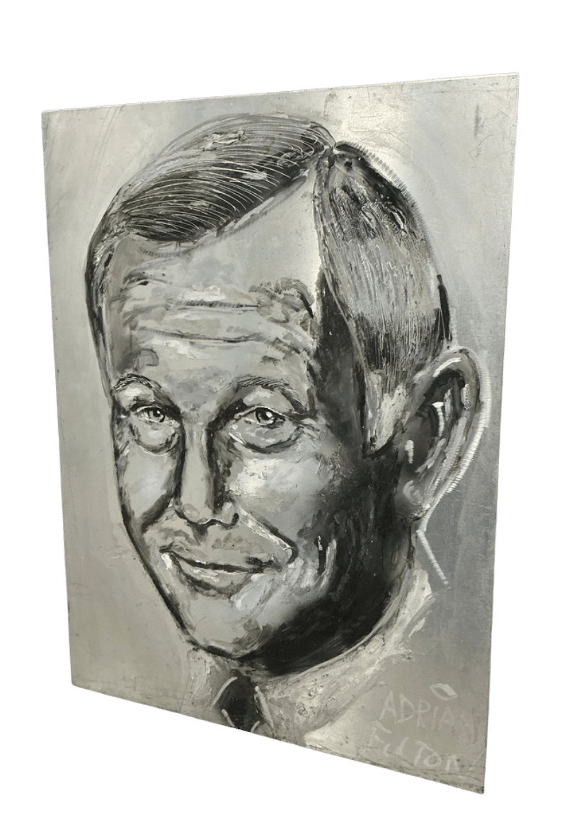 Three-quarter view of Johnny Carson portrait on engraved aluminum highlighting reflective silver tones and detailed facial features.
