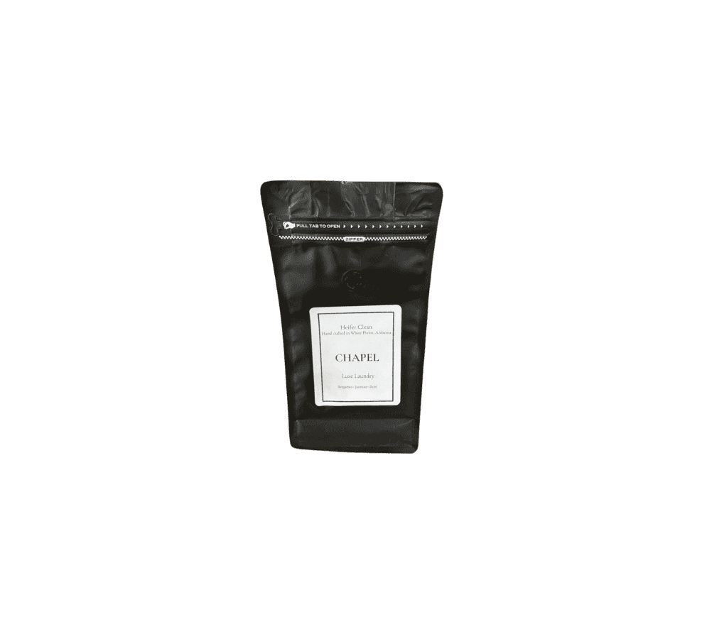 Heifer Clean Chapel luxe powder laundry detergent with bergamot jasmine rose fragrance.