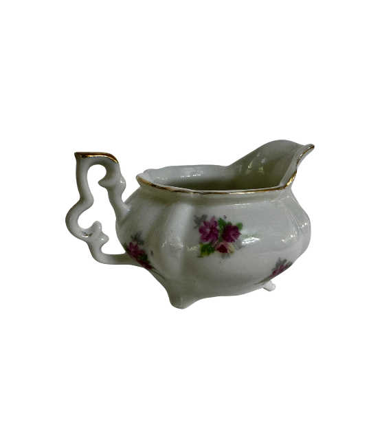 Side view highlighting the open scroll handle, purple rose decoration, and gold-edged rim of the ESCO creamer