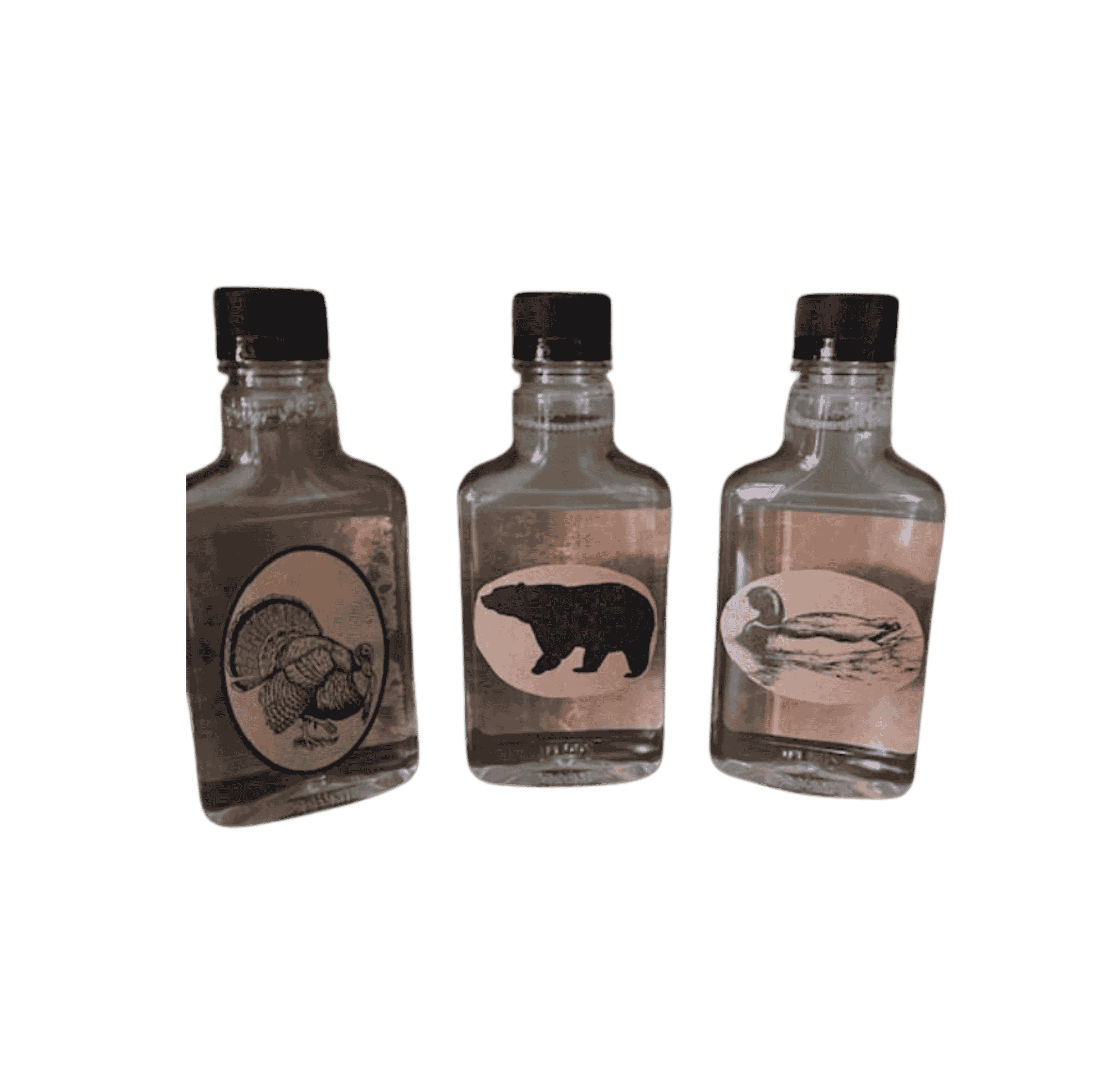 moonshine hot sauce flask trio with turkey, bear, and duck wildlife label designs