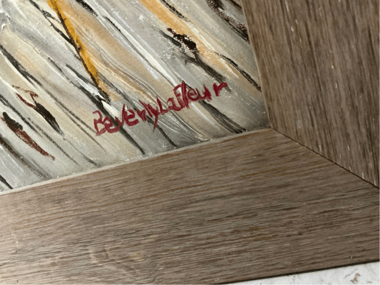 Artist signature by Beverly LaFleur painted in red on the lower corner of the artwork.