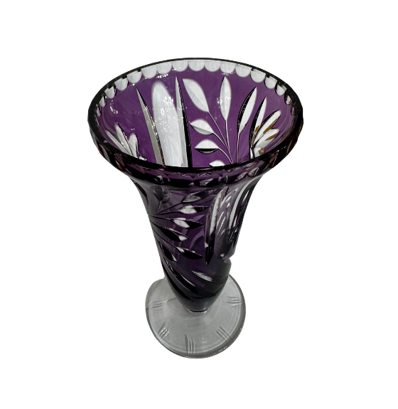 Angled view of an amethyst overlay crystal vase showing cut-to-clear leaves, sweeping stems, and a flared rim