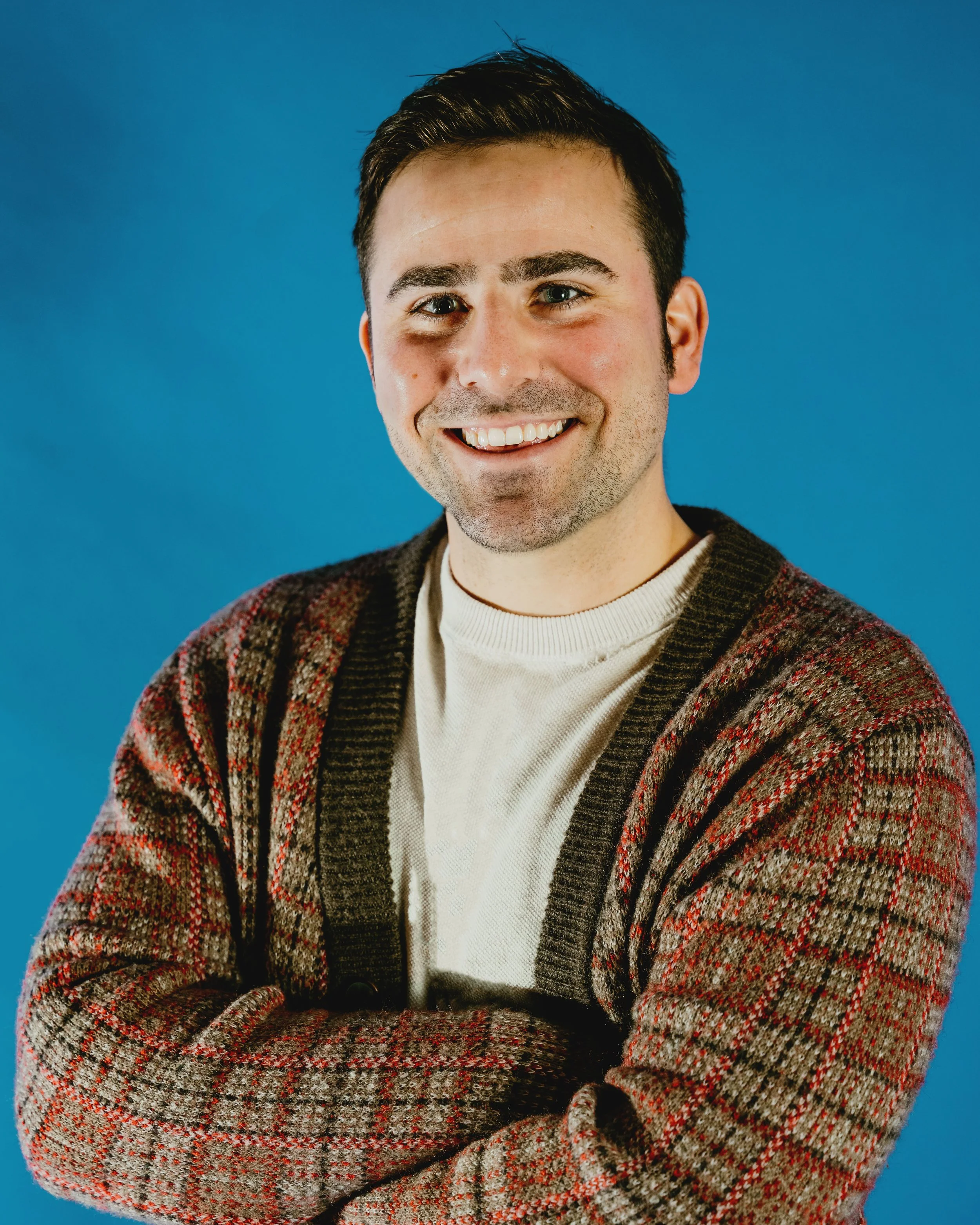 Portrait of Doug smiling and looking cute.