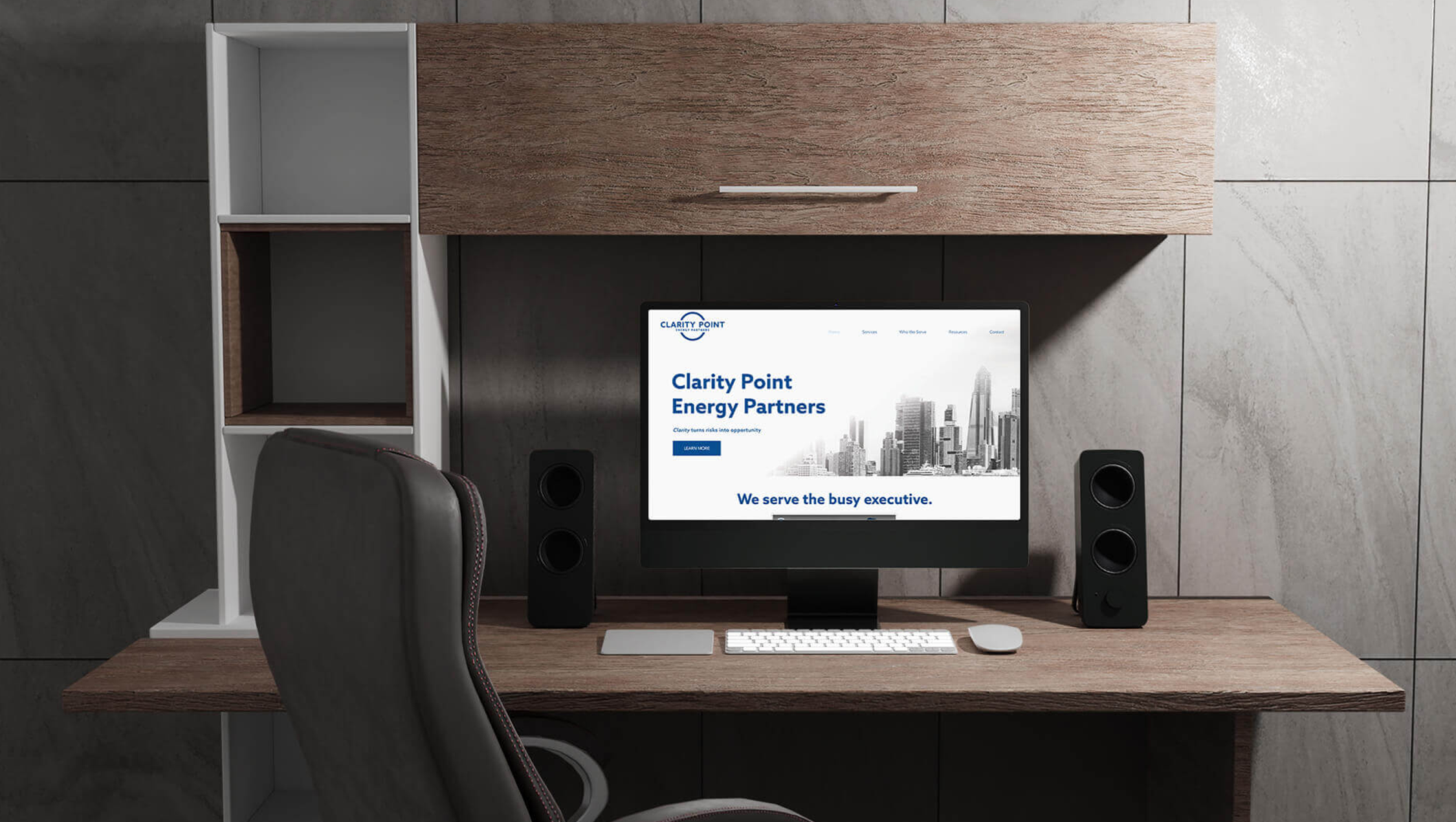 Desk with computer screen showing Clarity Point's website homepage