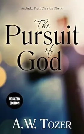 Cover of a book titled 'The Pursuit of God' by A. W. Tozer, with a blurred background including a person and soft lights.