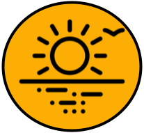 Sunset over a body of water with clouds in the sky