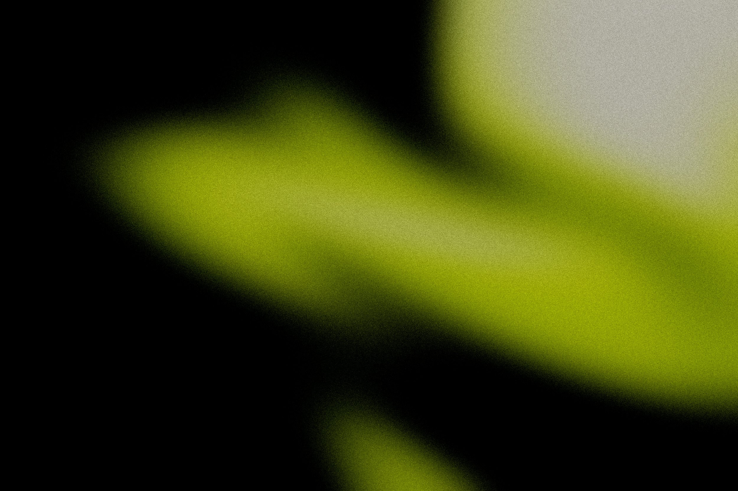 Close-up of a green gradient with a blurred background.