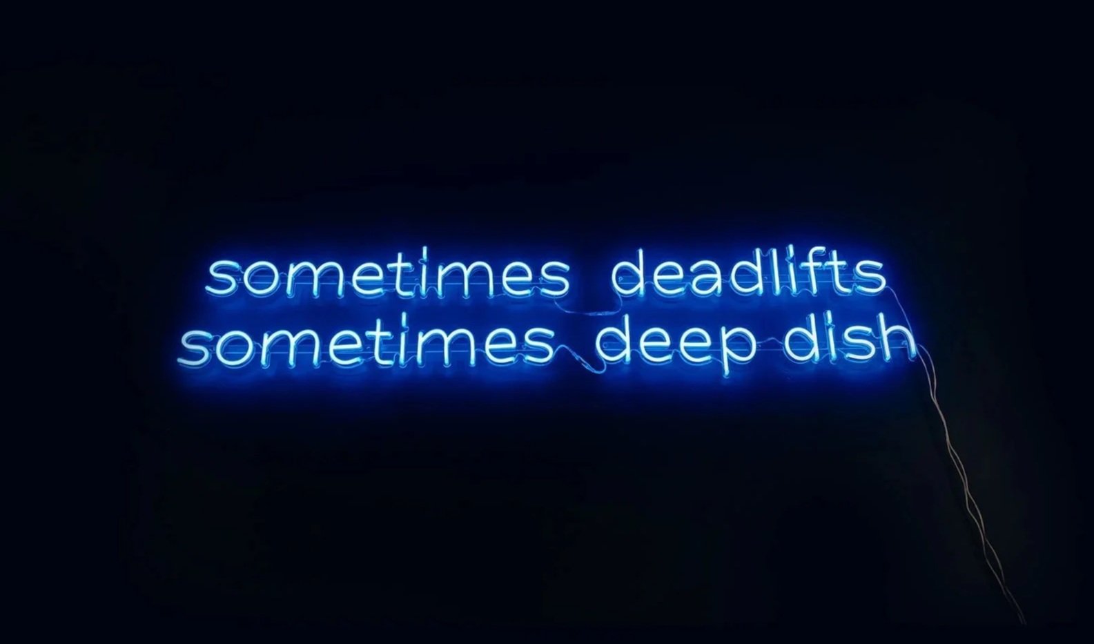 Above the Bar Chicago neon sign reading "Sometimes deadlifts, sometimes deep dish"