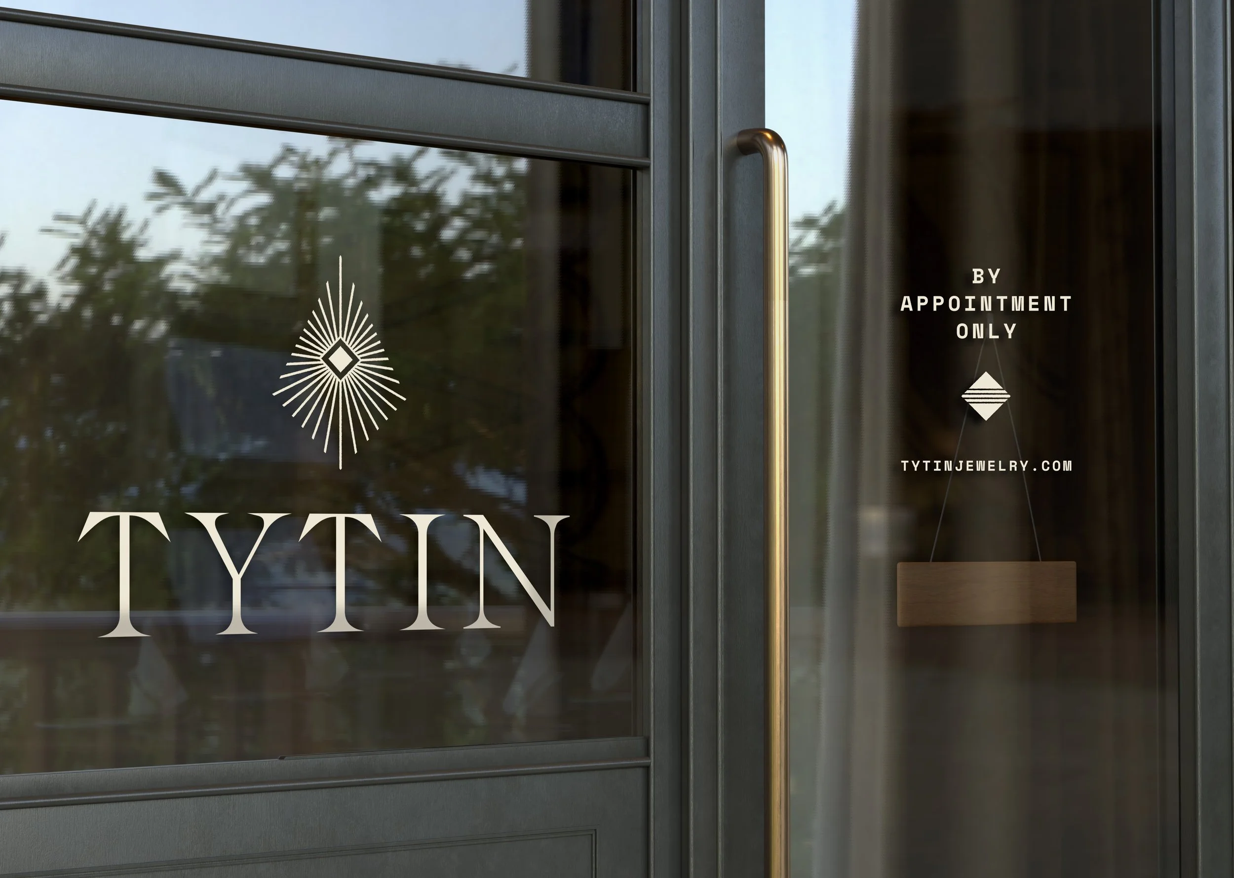 The glass door displays the logo and name of TYTIN jewelry, with a decorative geometric logo above the large text.